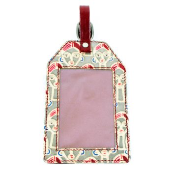 Face design leather luggage tag