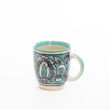 Ornate teal cup