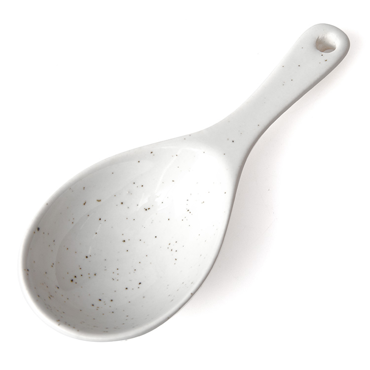 White speckled sauce spoon