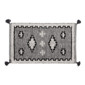 Small black and white tufted rug